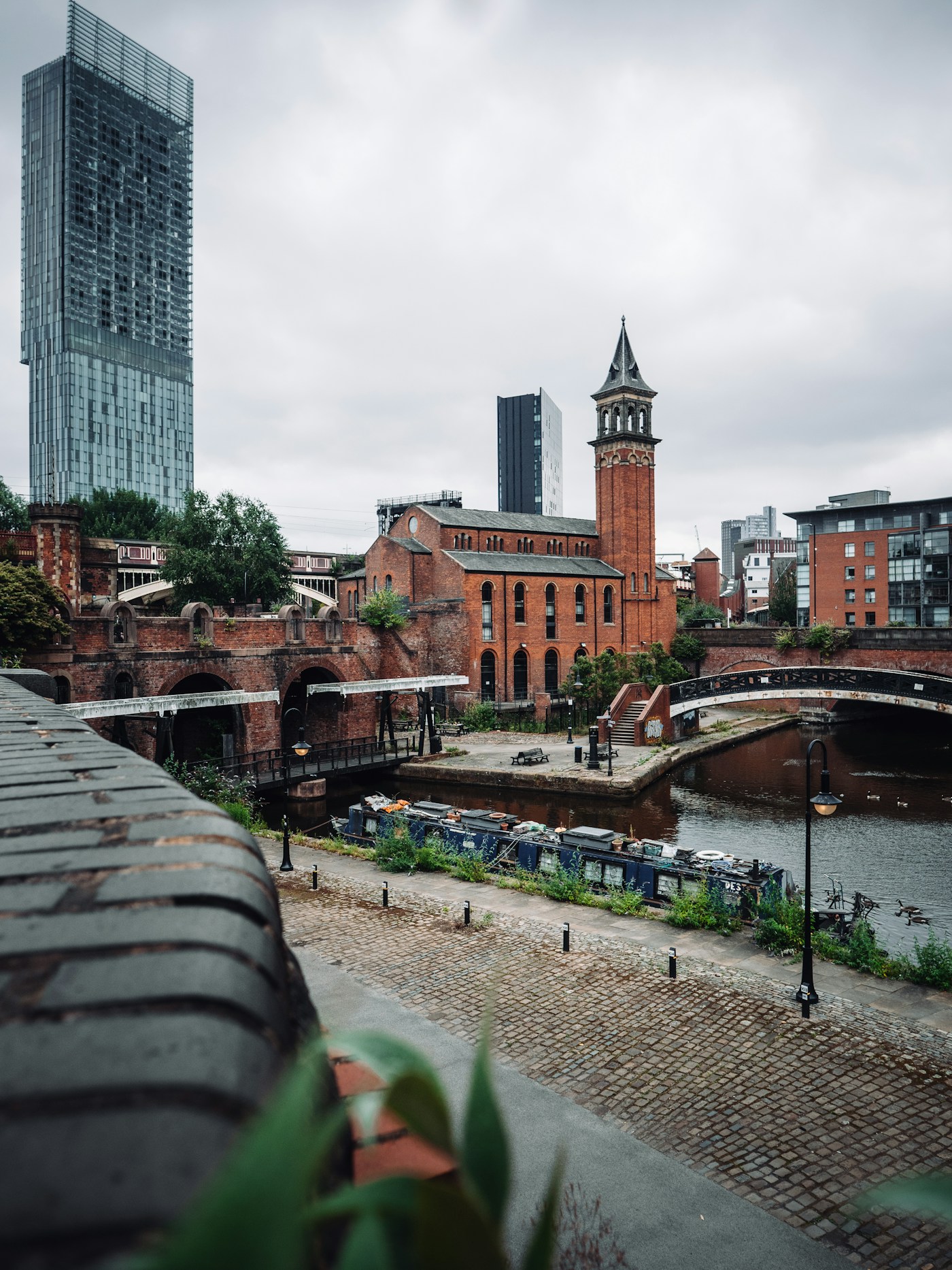 Canal-side buildings and a footbridge in Castlefield, Manchester